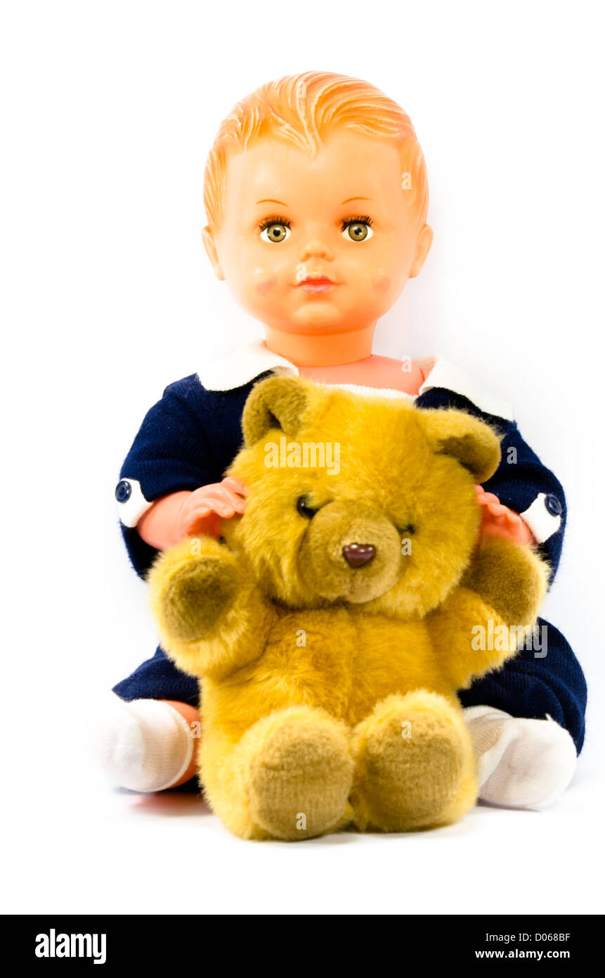 a doll and a teddy bear Stock Photo Alamy