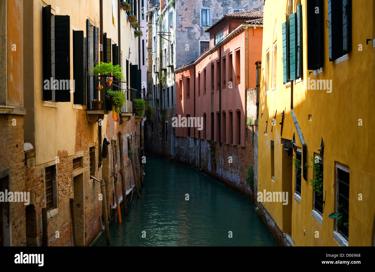 blue and green water of a venetian canal, Italy Stock Photo - Alamy