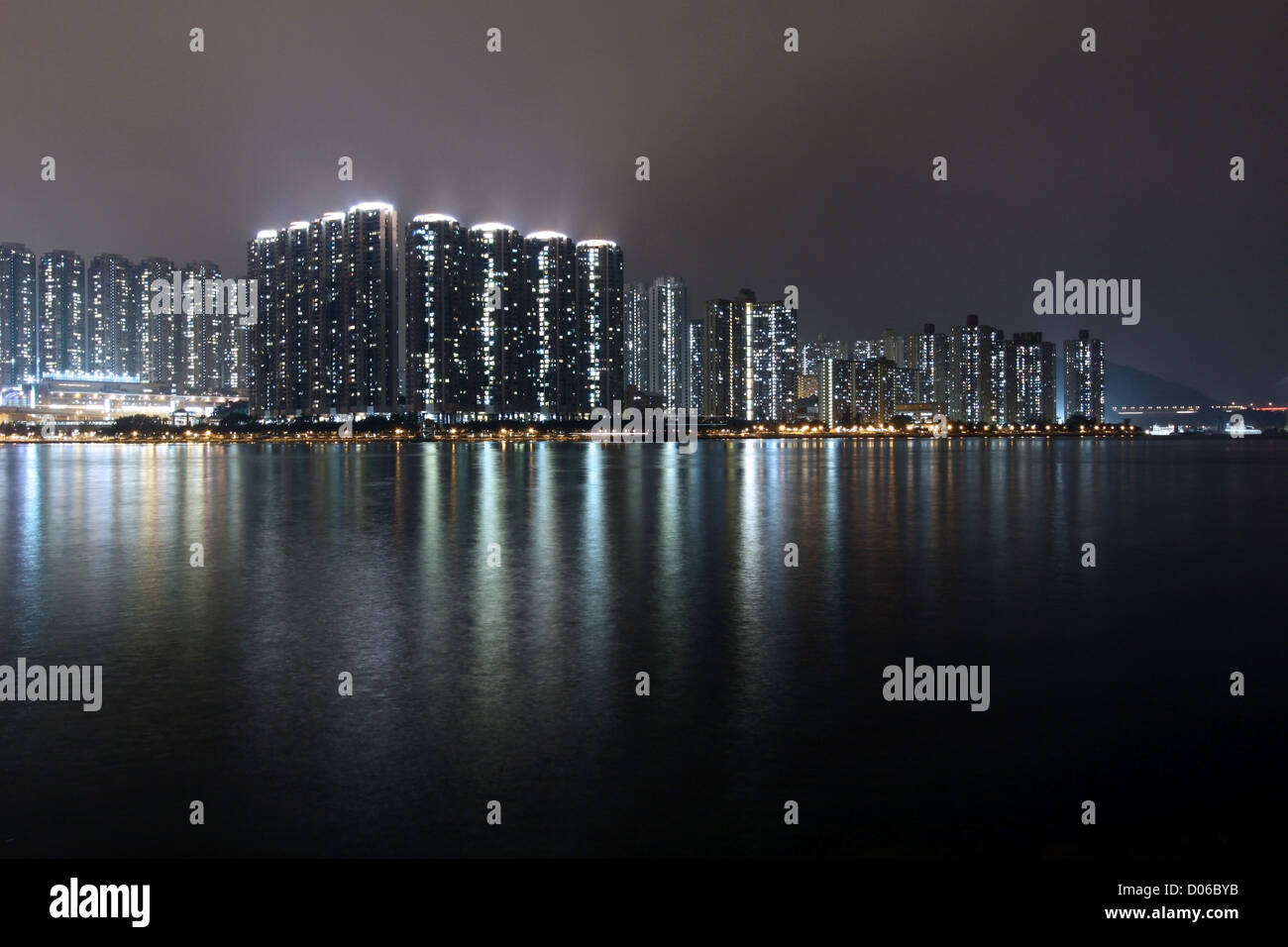 Hong Kong apartment blocks at night Stock Photo - Alamy