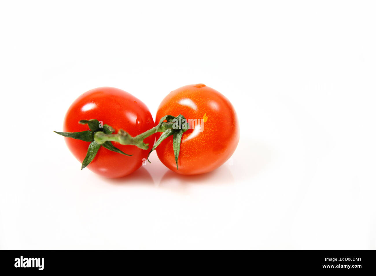 Cherry tomatoes isolated on white background Stock Photo - Alamy