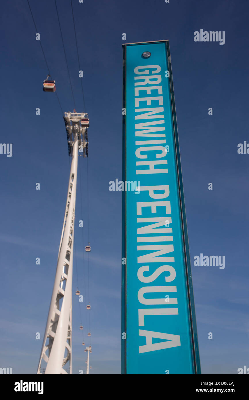 A location and direction sign on the Greenwich Peninsular, beneath the (Emirates) Thames Cable Car. There are 34 gondolas, each with a maximum capacity of 10 passengers. The Emirates Air Line (also known as the Thames cable car) is a cable car link across the River Thames in London built with sponsorship from the airline Emirates. The service opened on 28 June 2012 and is operated by Transport for London. The service, announced in July 2010 and estimated to cost £60 million, comprises a 1-kilometre (0.62 mi) gondola line that crosses the Thames from the Greenwich Peninsula to the Royal Docks. Stock Photo