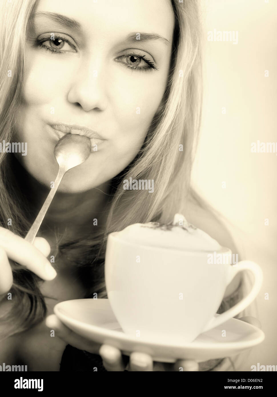 Beautiful woman holding cup of coffee Stock Photo - Alamy