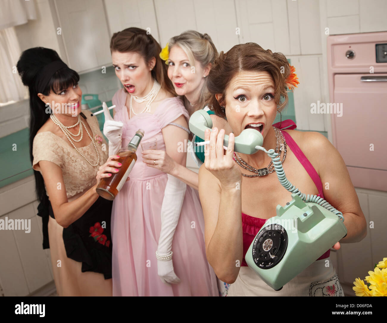 Retro-style woman yelling on phone while her friends drink and smoke Stock Photo