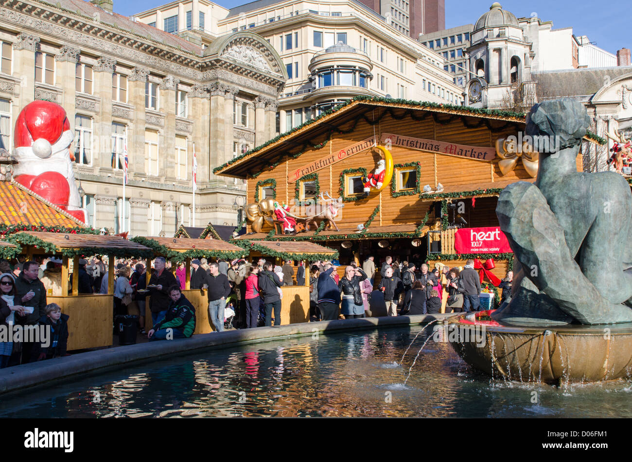 People eating and drinking at Birmingham's German Market Stock Photo