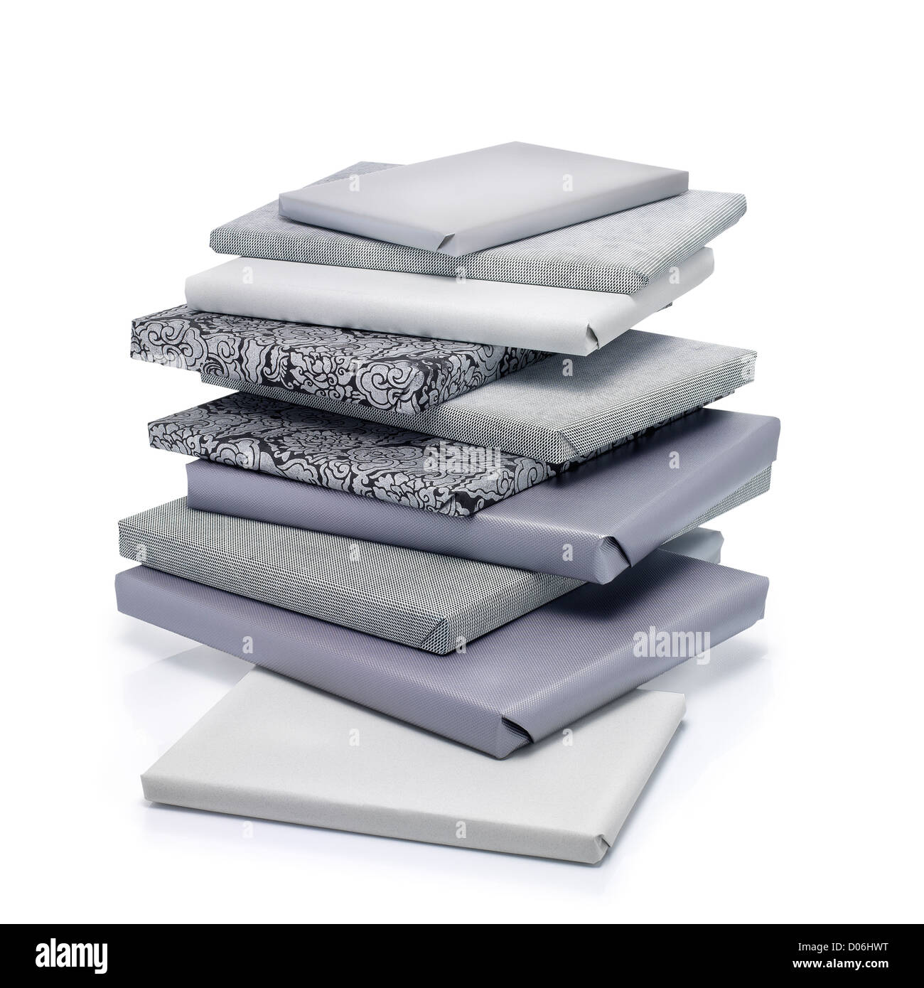 Stack of books wrapped gift in gray color. Clipping path Stock Photo