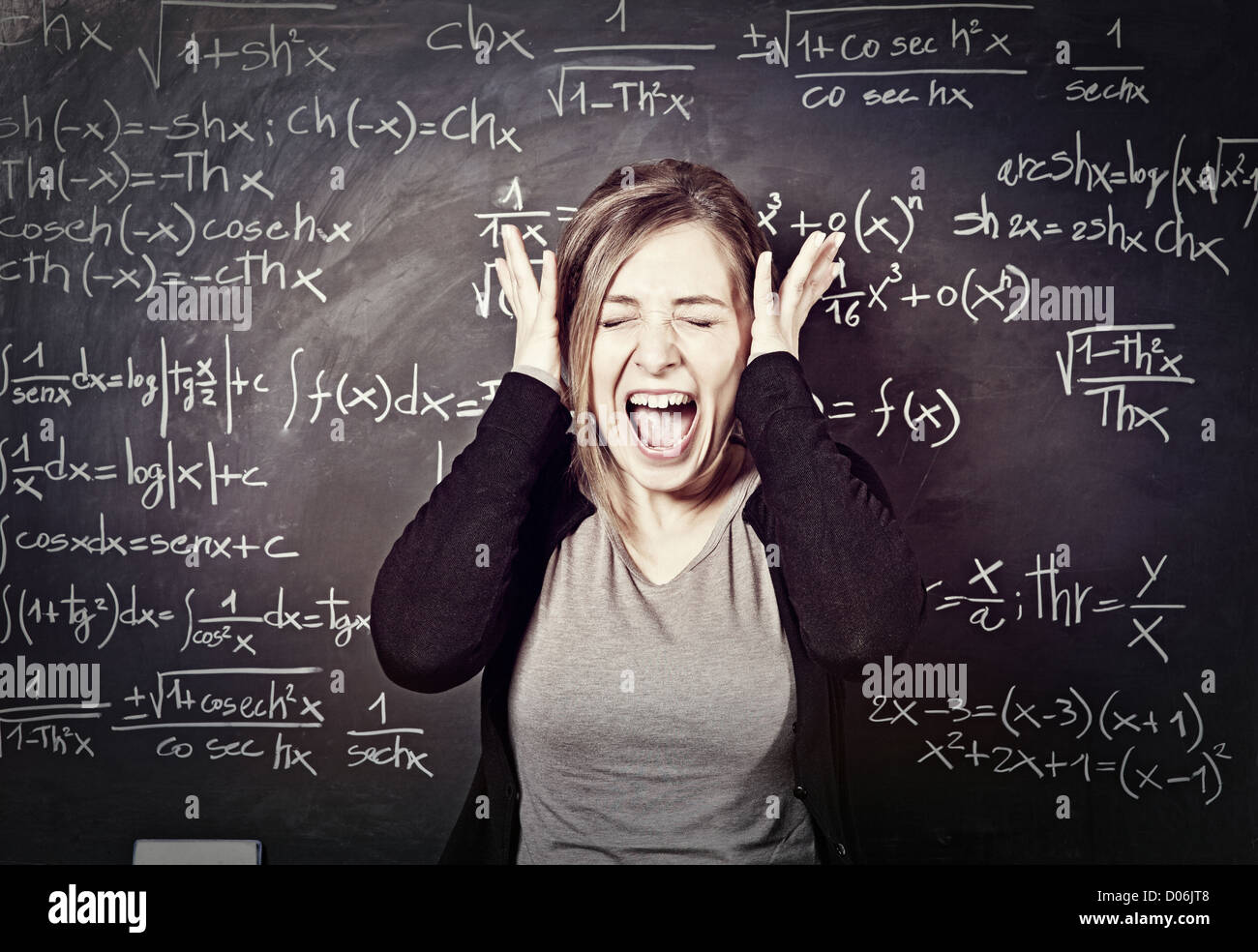portrait of stressed teacher and blackboard background Stock Photo