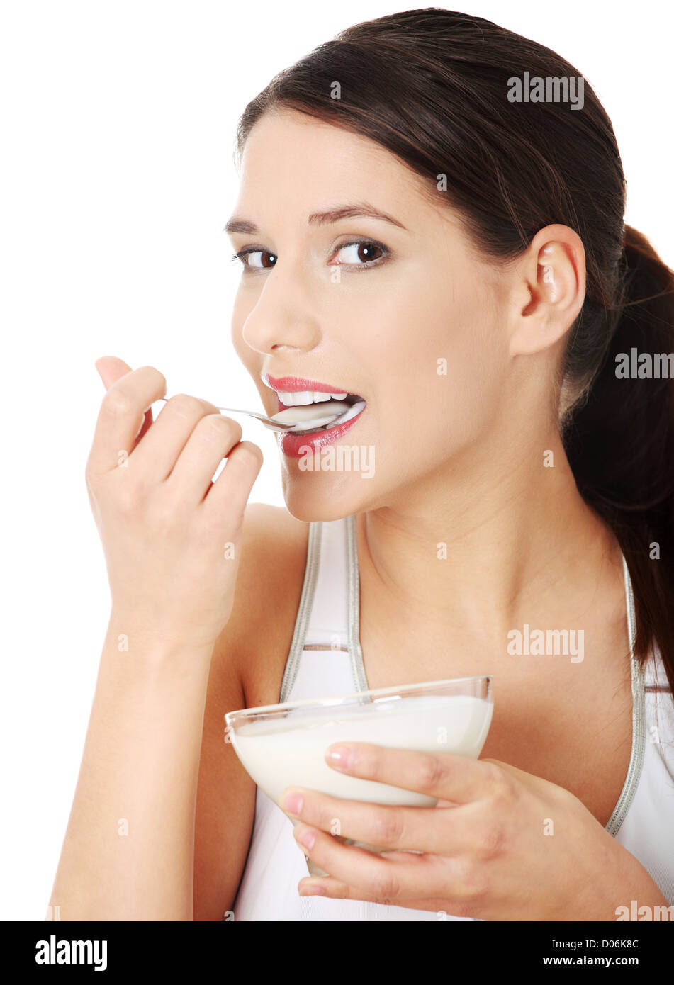 Young beautiful woman eating yogurt Stock Photo Alamy