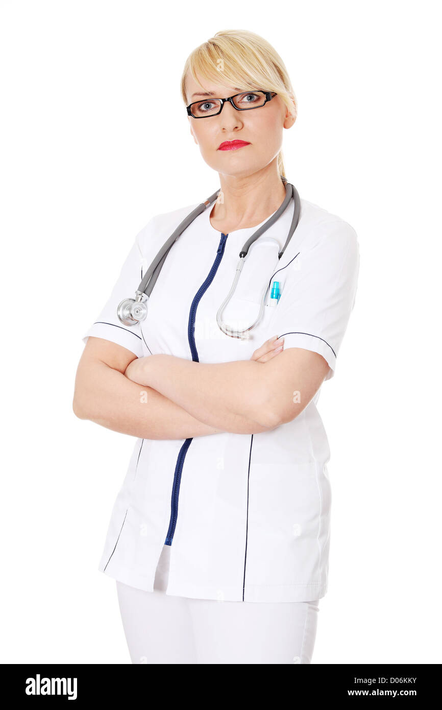 Mature female doctor or nurse isolated on white background Stock Photo ...