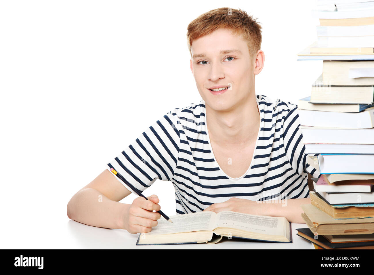 Teen boy learning at the desk Stock Photo Alamy