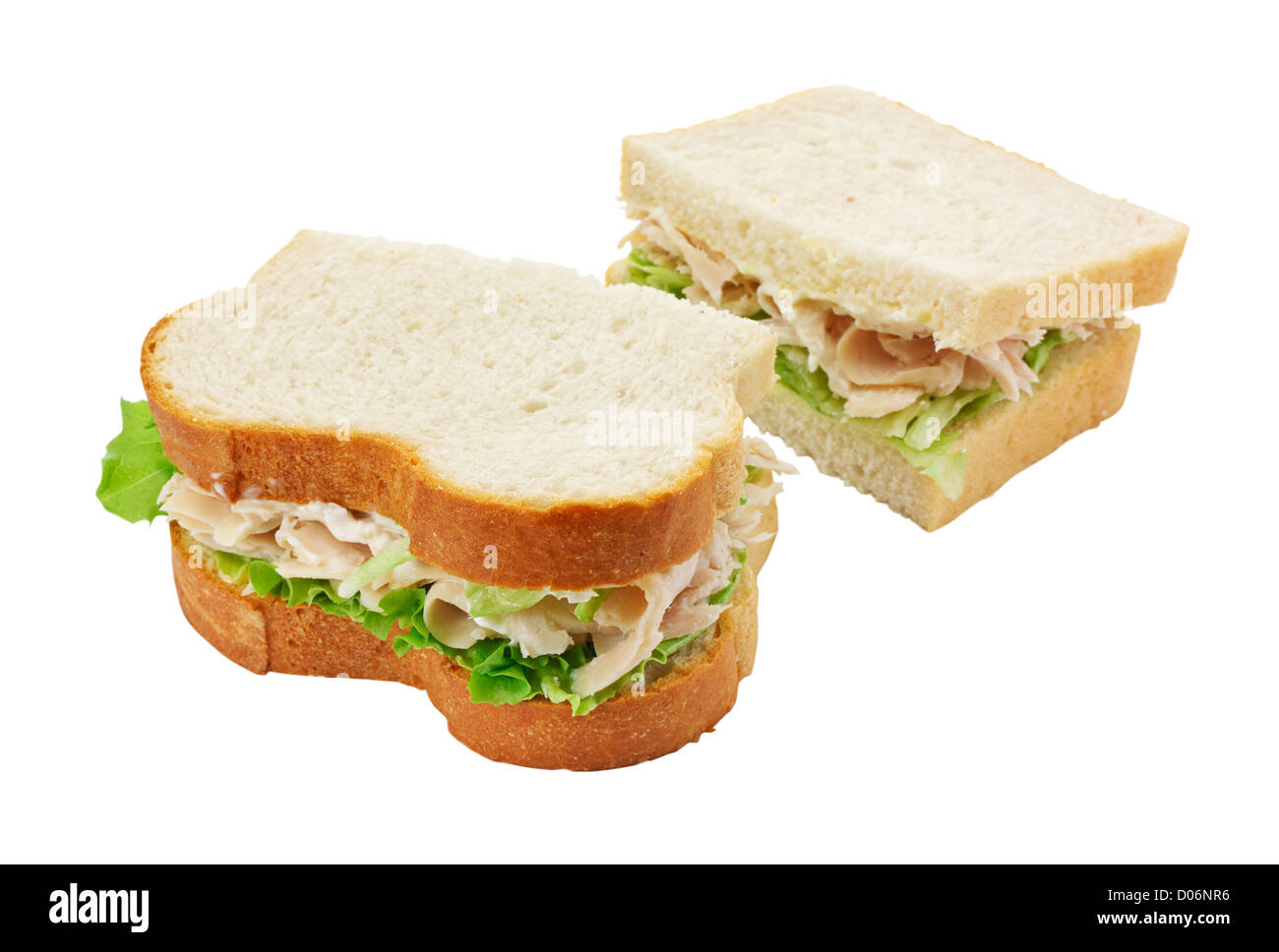 A ham salad sandwich made with freshly sliced bread cut in half with focus on the filling Stock Photo