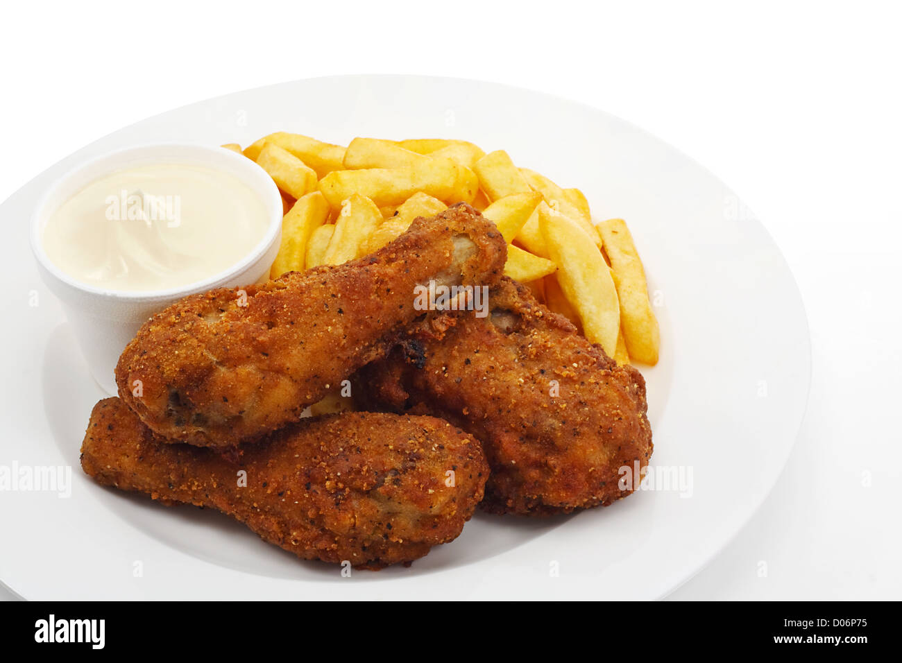 Three pieces of crispy southern fried chicken with fries Stock Photo
