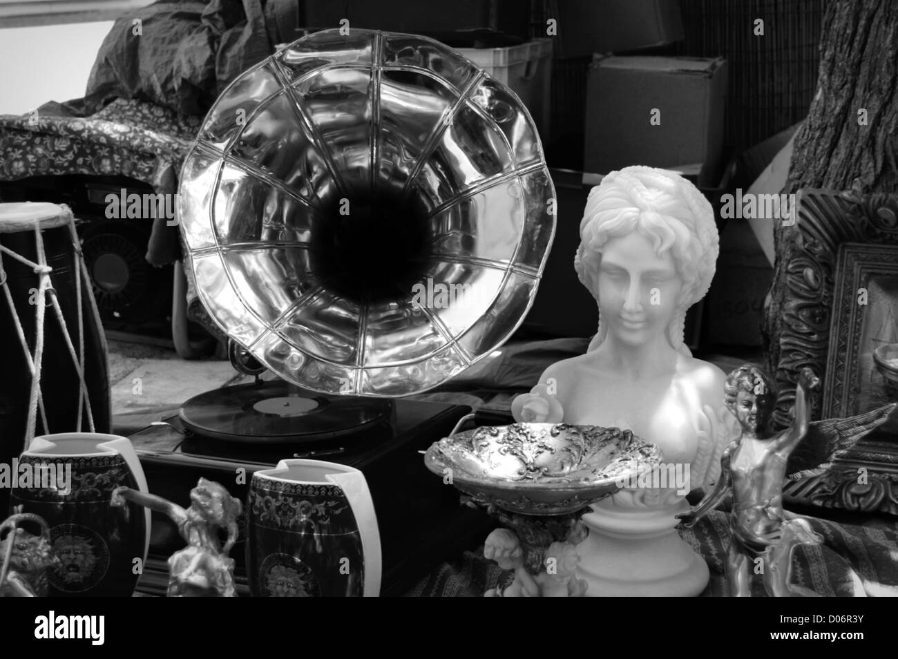 Vintage gramophone and antique objects at street fair. Black and white. Stock Photo
