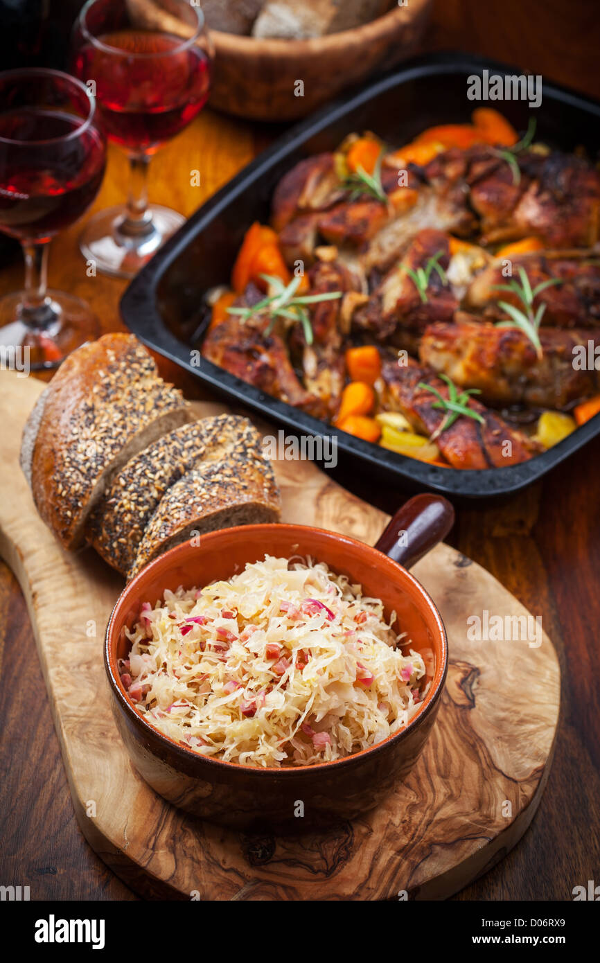 Sauerkraut with roasted pork belly on vegetables and red wine Stock ...