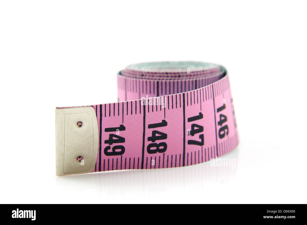 rolled pink measure tape isolated on white background Stock Photo