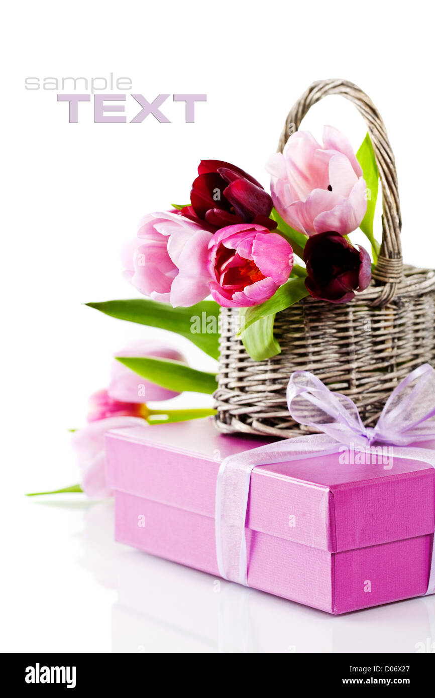 Pink tulips and gift box on a white background. With easy removable ...