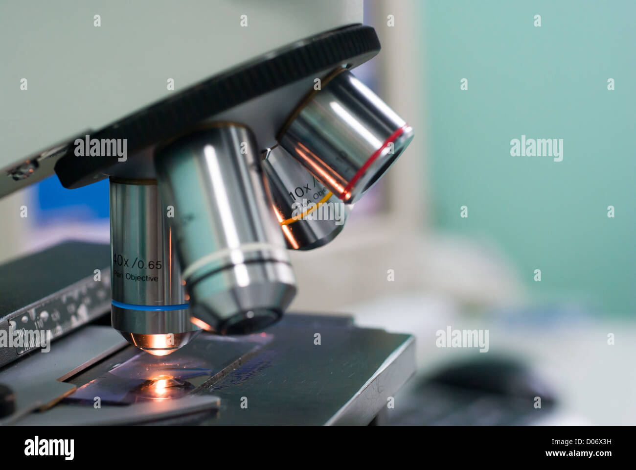 Closeup of microscope lenses. Shallow depth of field. Focus on "blue
