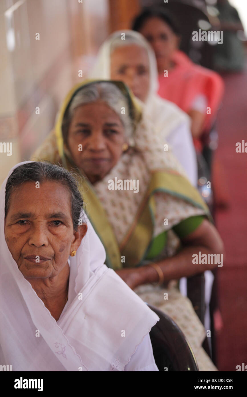 Picture of old age women  worshiping Jesus in Kerala. Stock Photo