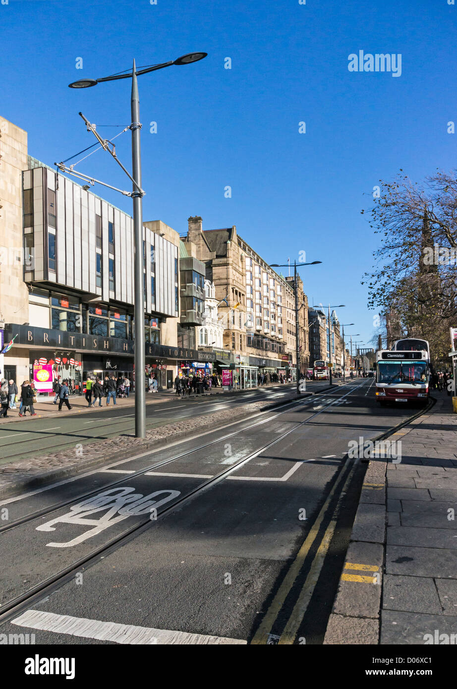 Progress of tram works in Princes Street Edinburgh with track in place and catenary pylons in place but overhead wiring missing Stock Photo