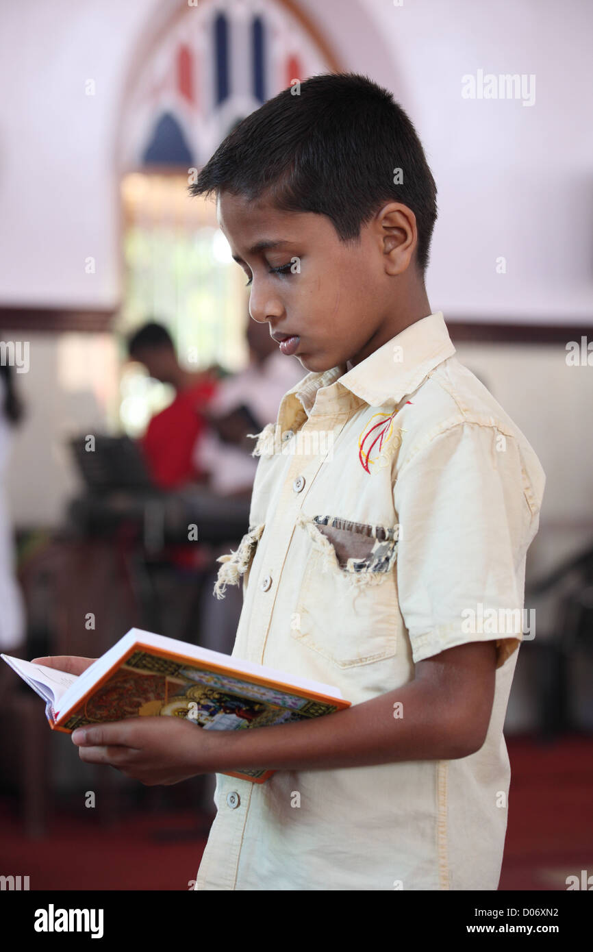 Boy kneeling in prayer hi-res stock photography and images - Alamy