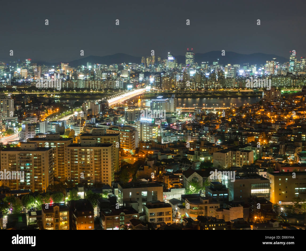 A night time view across the lit-up skyline of the city of Seoul, South Korea. Stock Photo