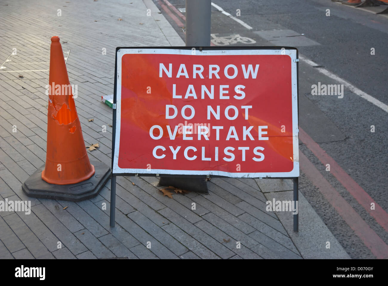 narrow lanes do not overtake cyclists road sign in southwark, london, england Stock Photo