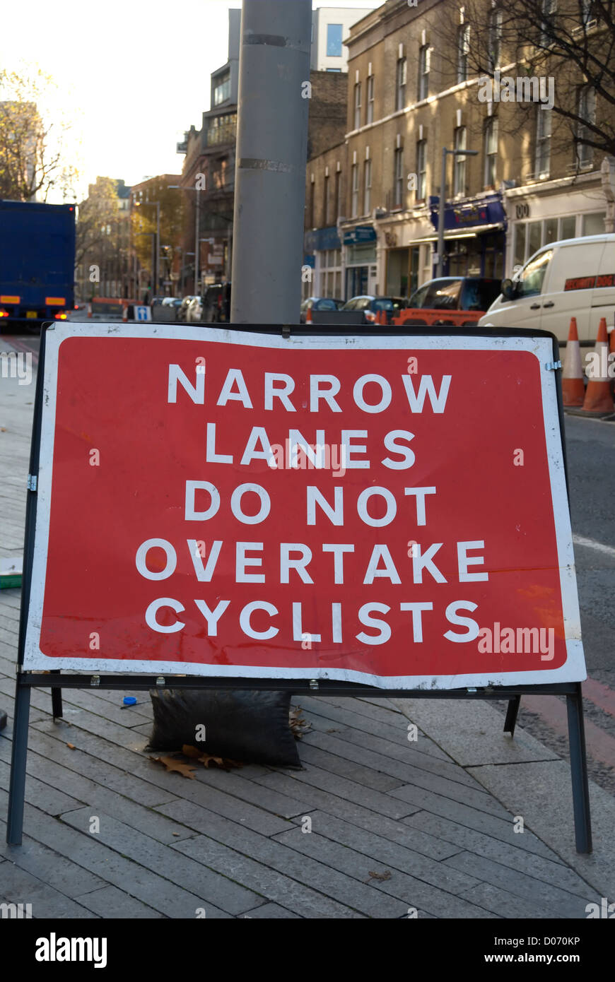 narrow lanes do not overtake cyclists road sign in southwark, london, england Stock Photo