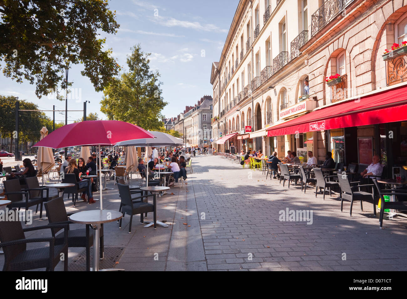 People eating outdoors at a restaurant in Nantes, France. Stock Photo