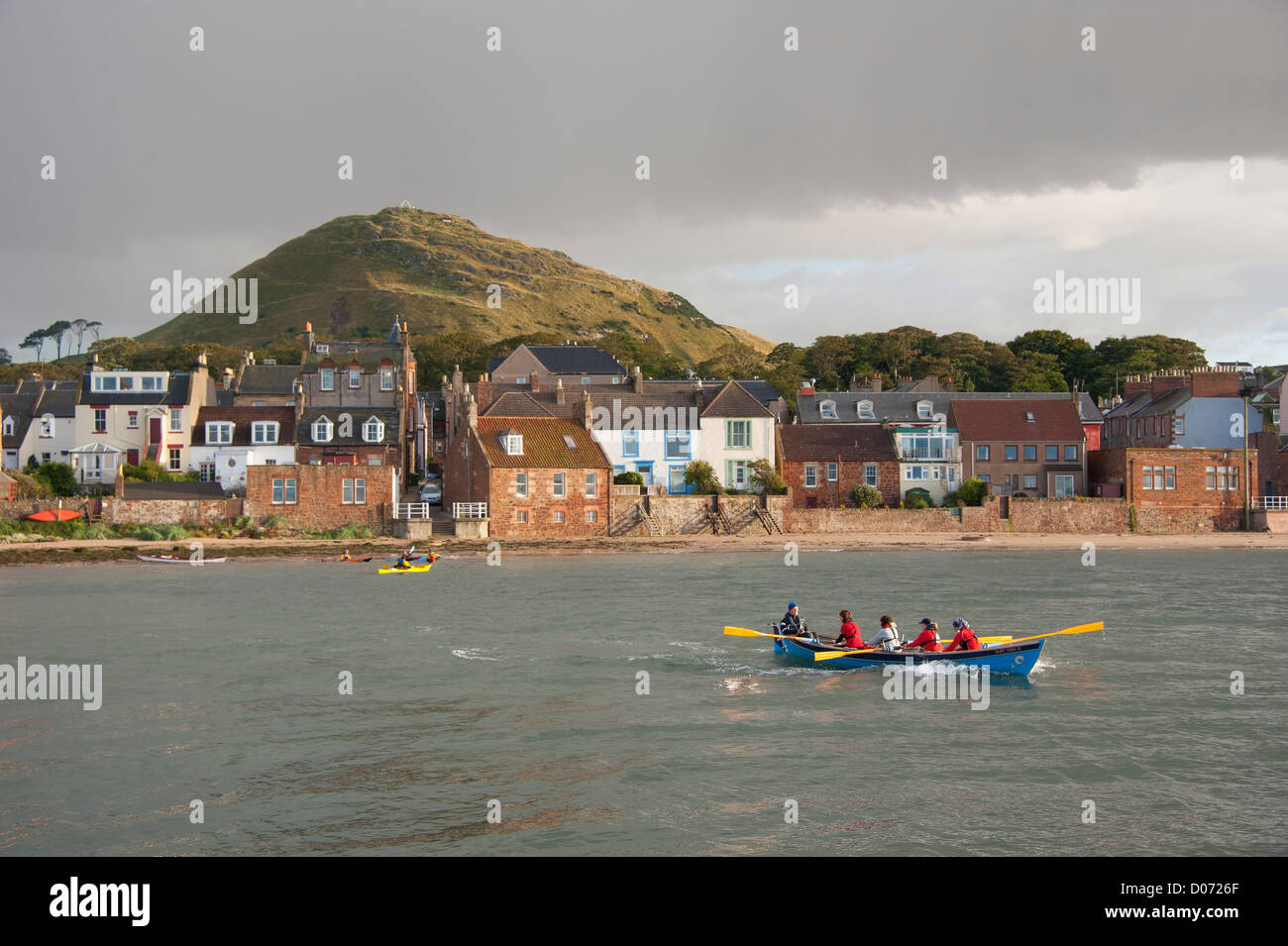 A rowing skiff at North Berwick, with the North Berwick Law (ancient volcano) in the background. East Lothian, Scotland. Stock Photo