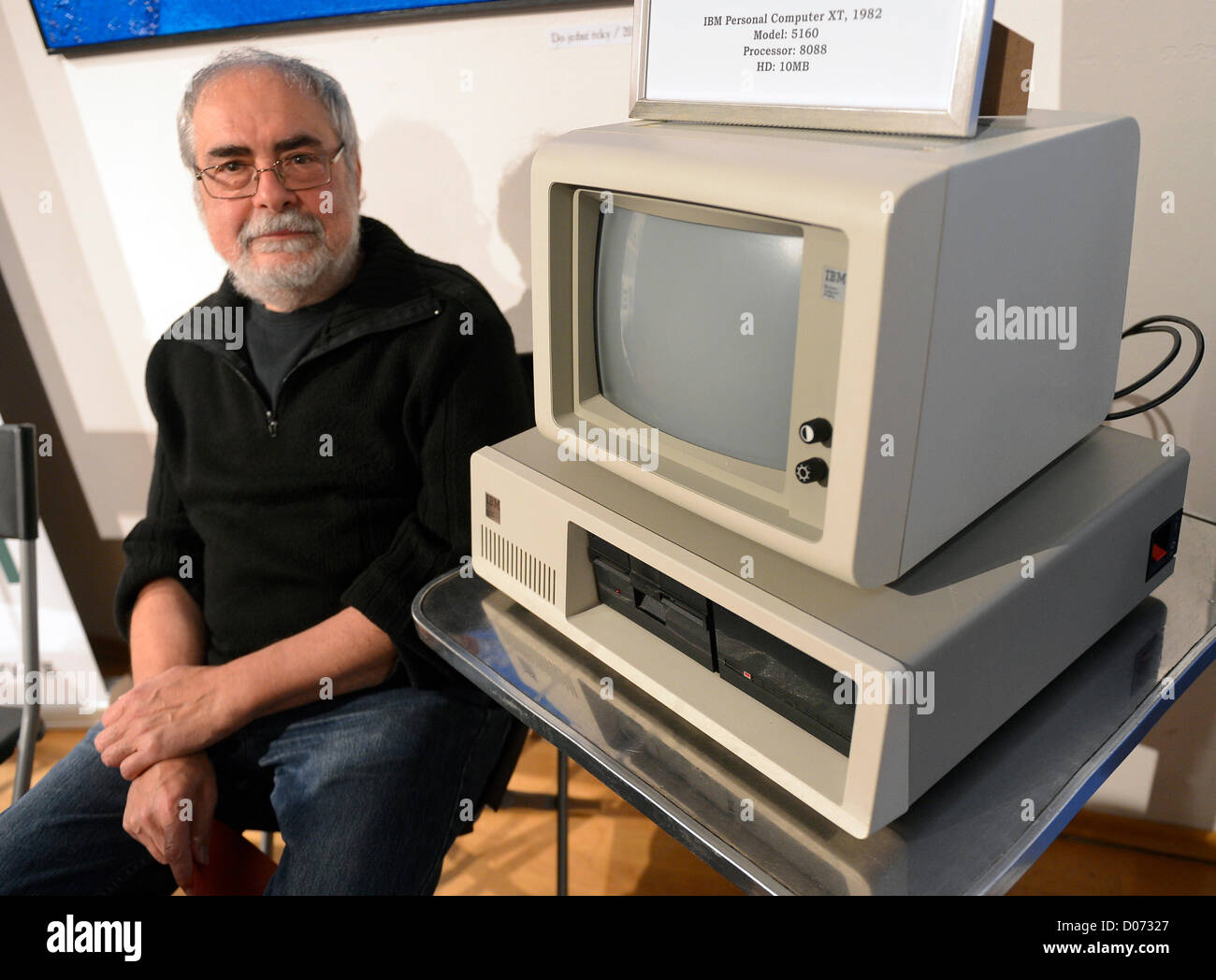 Vladimir Hanzel, former personal secretary of Vaclav Havel poses with an old IBM computer which the former Czech president Vaclav Havel used in 1980s. Vaclav Havel Library received this computer into its collection in Prague, Czech Republic on November 19, 2012. (CTK Photo/Michal Dolezal) Stock Photo