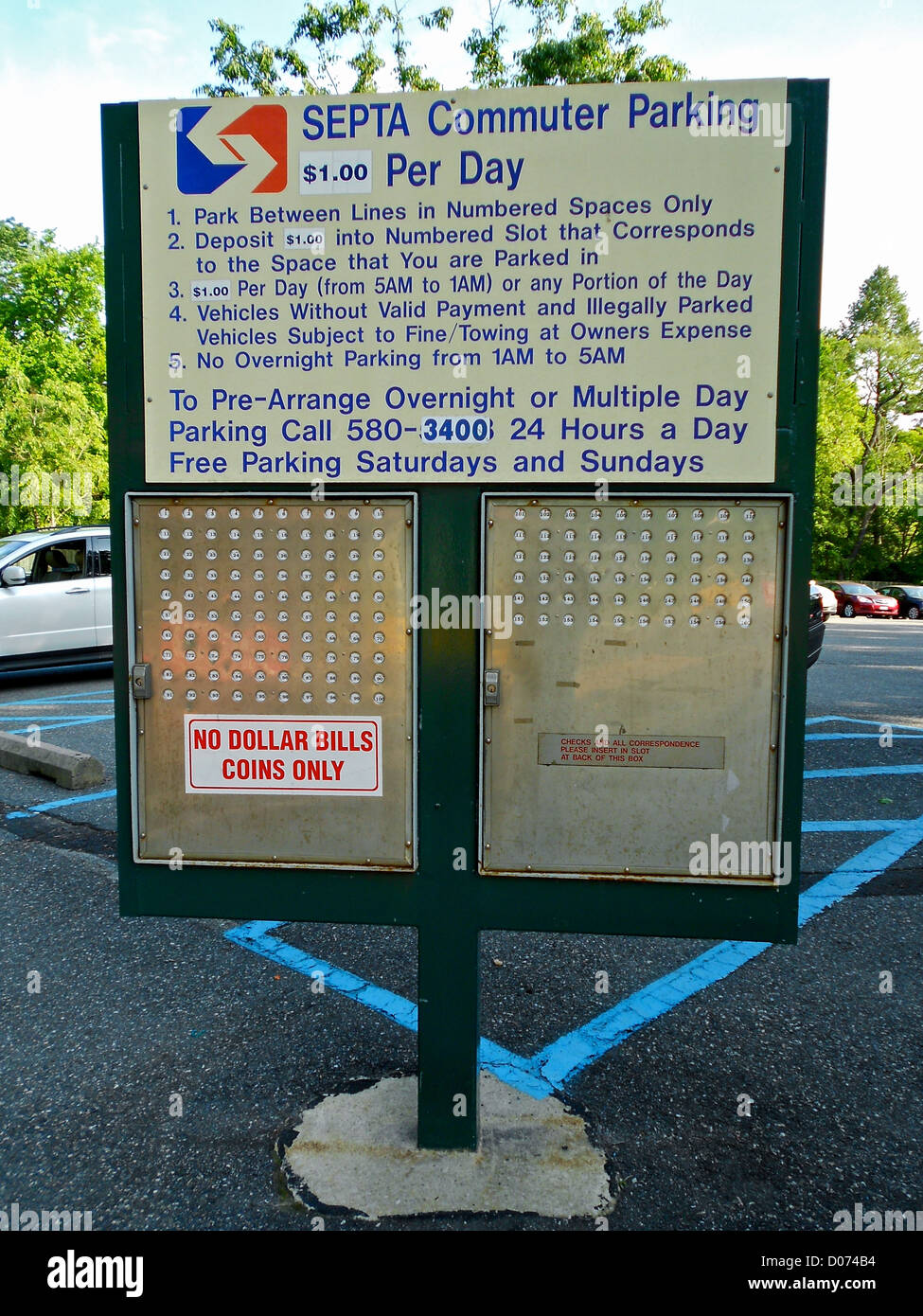 A parking sign and payment device at the Moylan-Rose Valley SEPTA ...