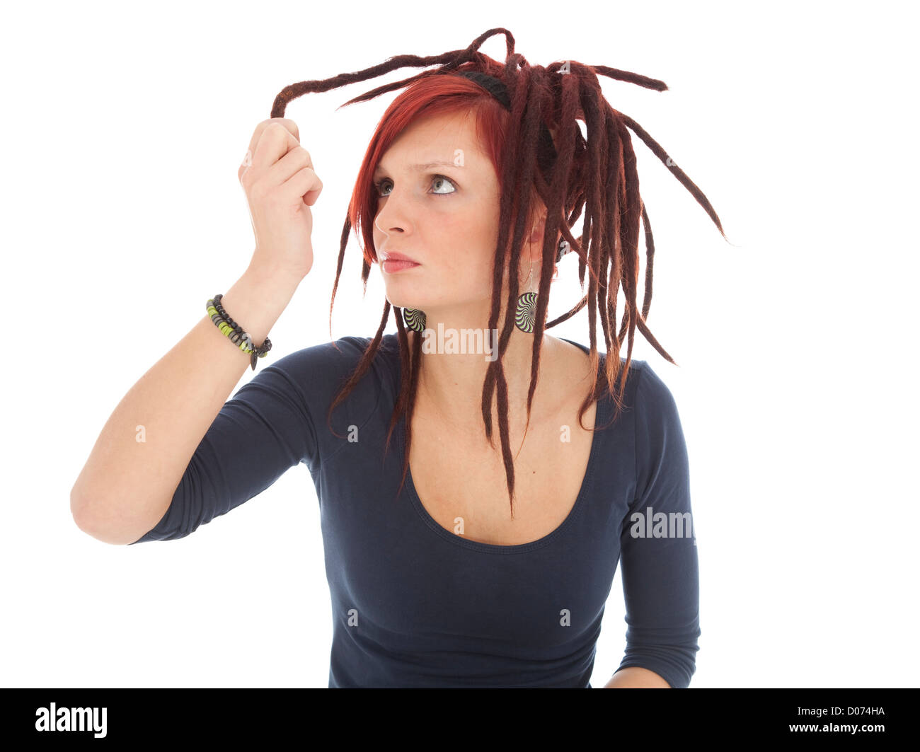red-haired girl with dreadlocks on white background Stock Photo