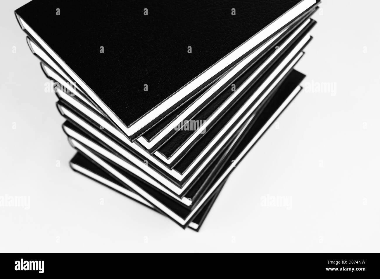 Many books in a pile black and white photo. Stock Photo