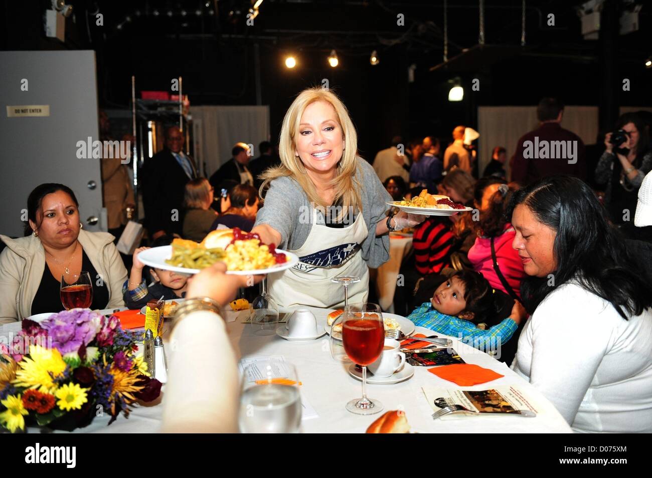 Nov. 19, 2012 - Manhattan, New York, U.S. - KATHIE LEE GIFFORD, Police Commissioner Raymond Kelly, former Mayor David Dinkins, Miss America 2012 pageant winner Laura Kaeppeler, Guardian Angels founder Curtis Sliwa and Hoda Kotb and others volunteer serving the NYC Rescue Mission's 12th annual ''Great Thanksgiving Banquet'' meals to homeless residents, Downtown Community Television Center, Monday November 19, 2012. (Credit Image: © Bryan Smith/ZUMAPRESS.com) Stock Photo