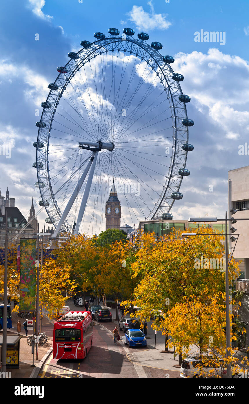 The London Eye on SouthBank and Big Ben, with new hydrogen powered red London bus in foreground and autumnal colour London UK Stock Photo