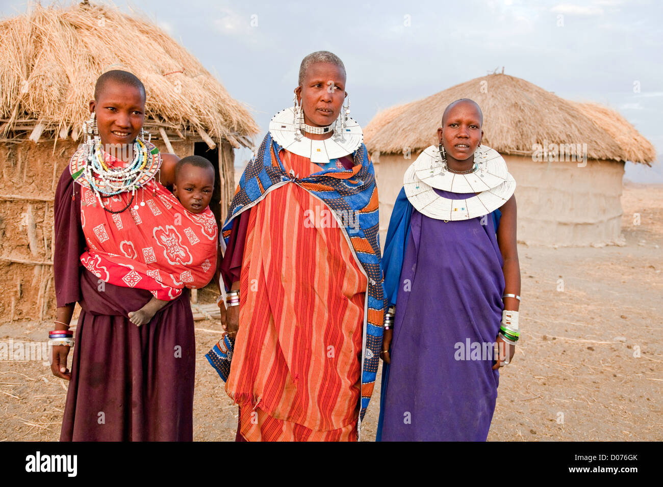 Three Maasai Women with Babies at Tanzania;East Africa;Africa;Authentic Cultural Village in Olpopongi;Maasai Stock Photo