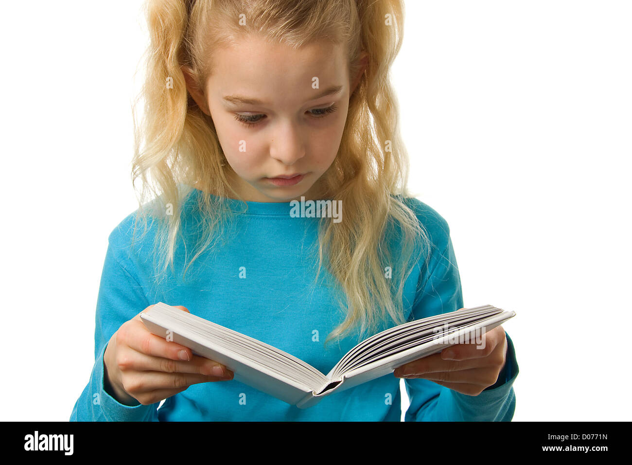 Young girl is reading a book over white background Stock Photo - Alamy