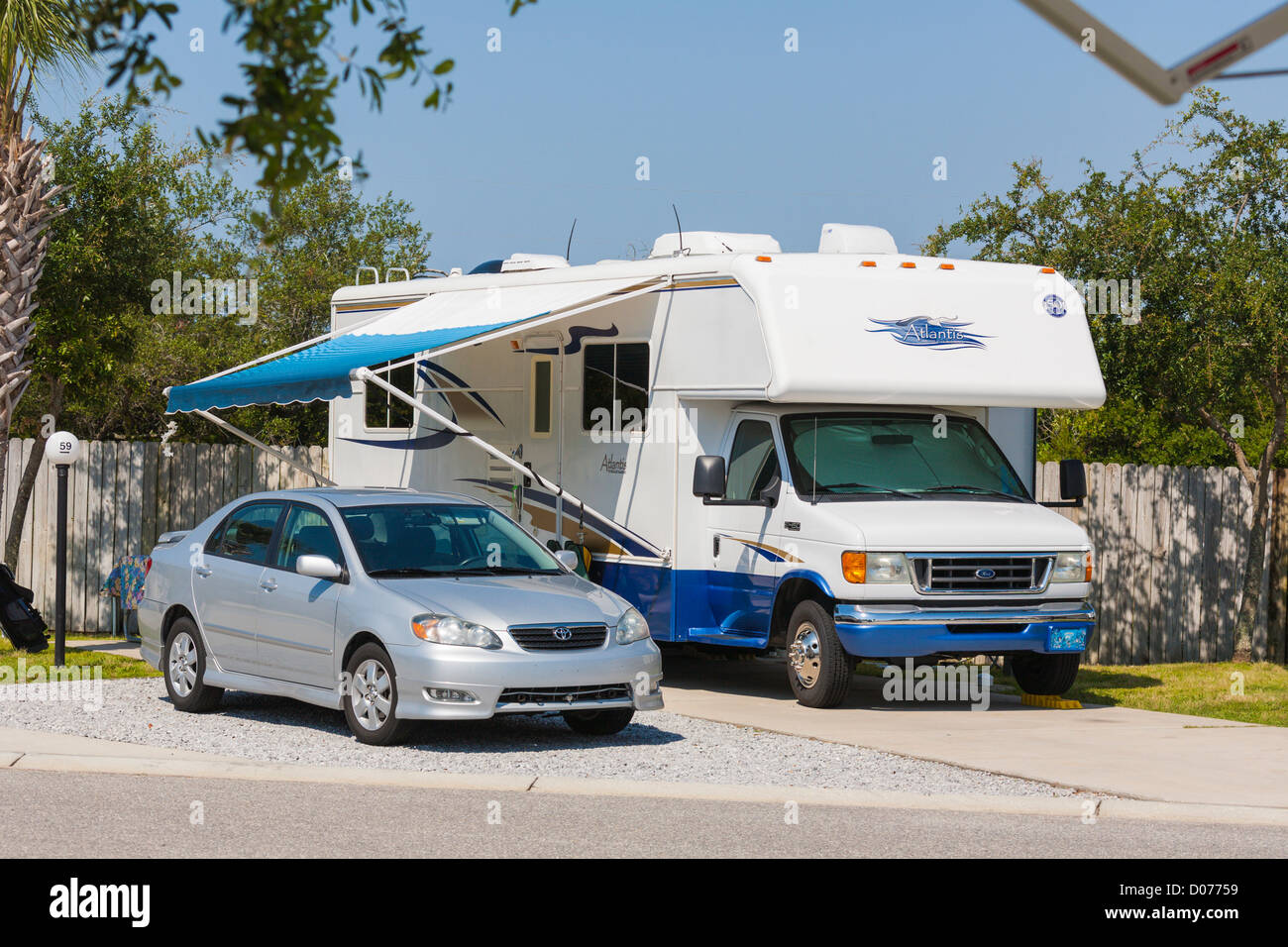 Car and motorhome parked at RV Resort in Navarre, Florida Stock Photo