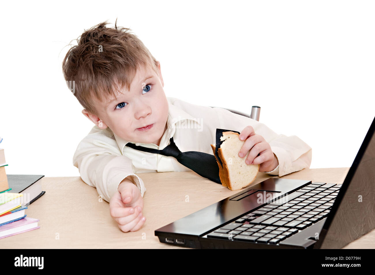 thoughtful boy eating a sandwich with his tie isolated on white background Stock Photo