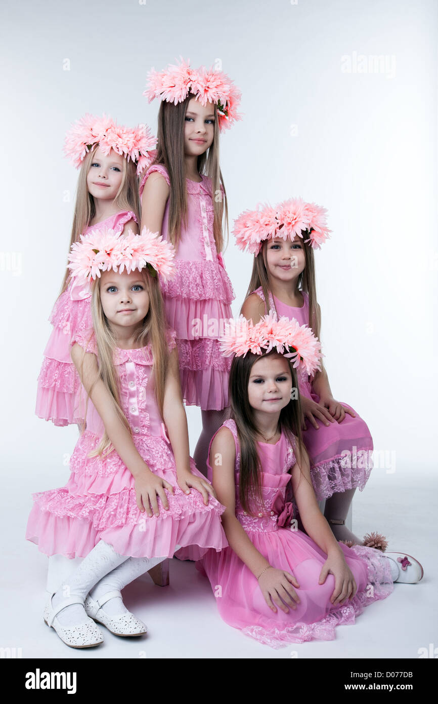 Studio portrait of five little girls in pink dresses and wreaths Stock ...