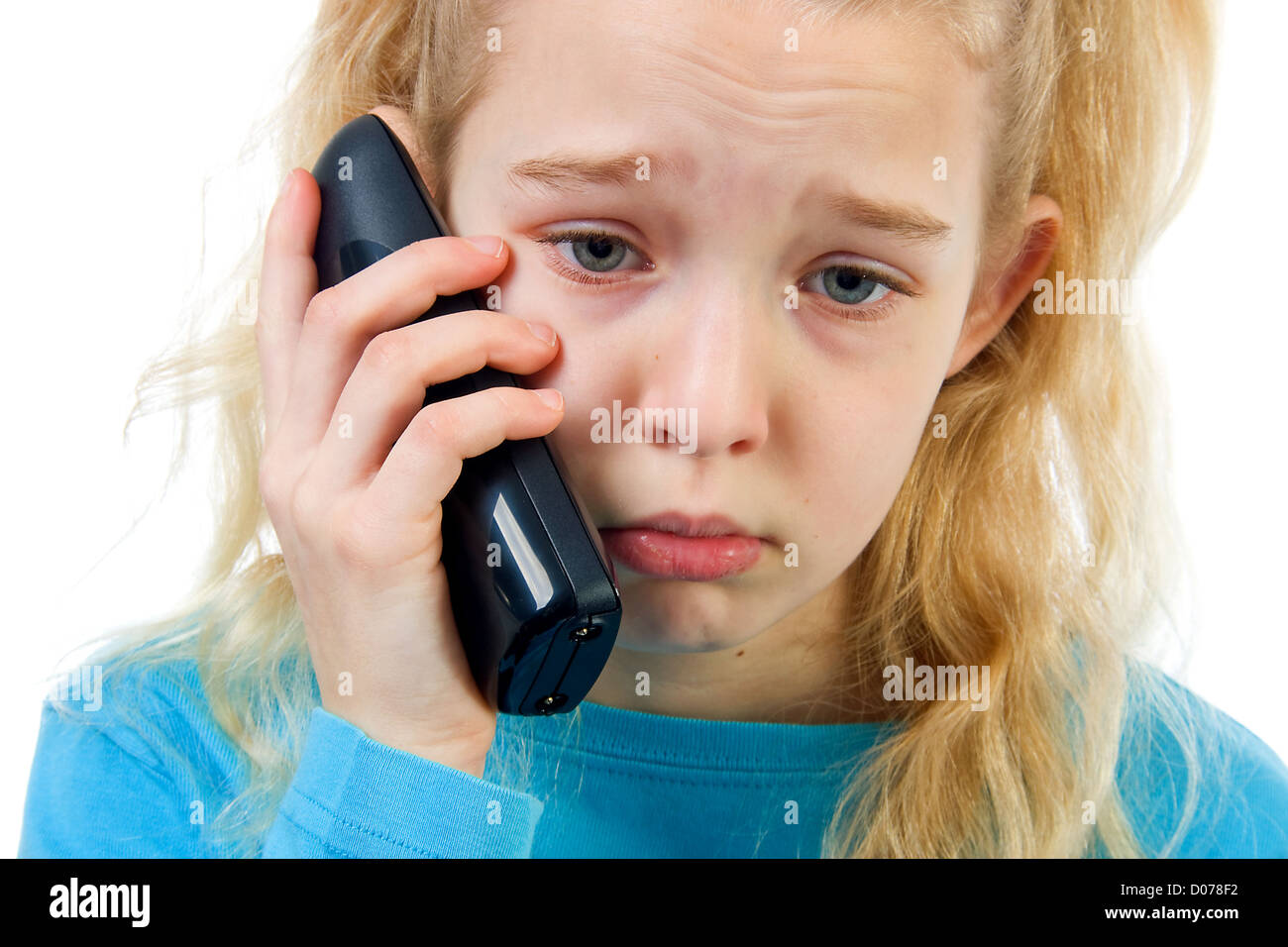 sad girl on the phone, bad news, isolated on white background Stock Photo