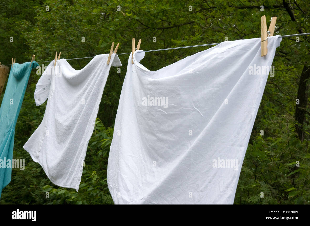 Clothes drying in the wind hanging on a clothesline Stock Photo