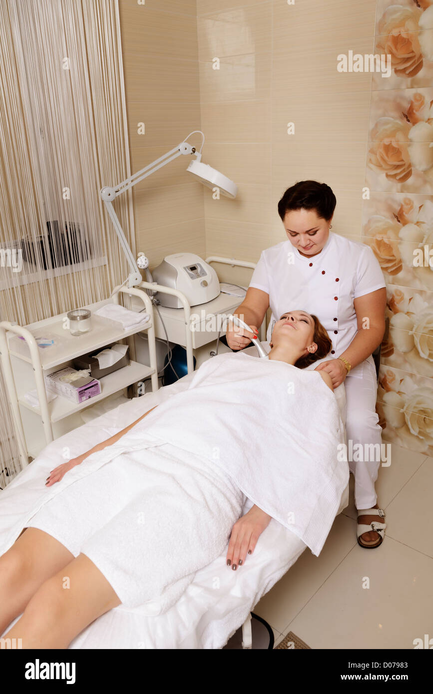 woman spa salon treatment procedure health beauty body wellness Stock Photo
