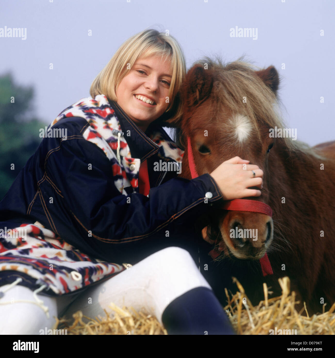 Teenager girl pony Stock Photo