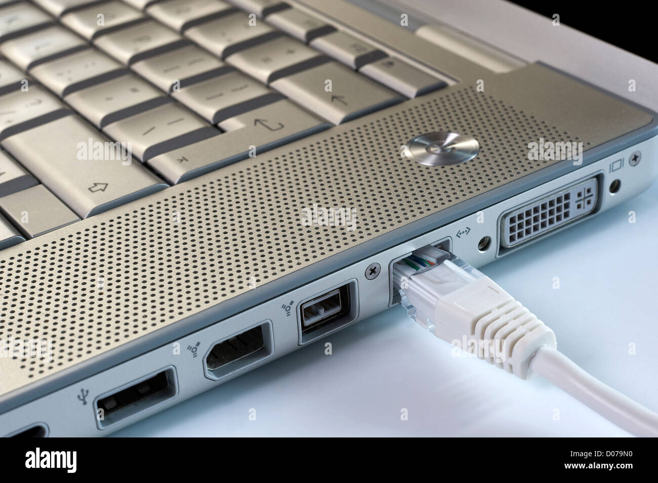 A laptop with an internet wire Stock Photo