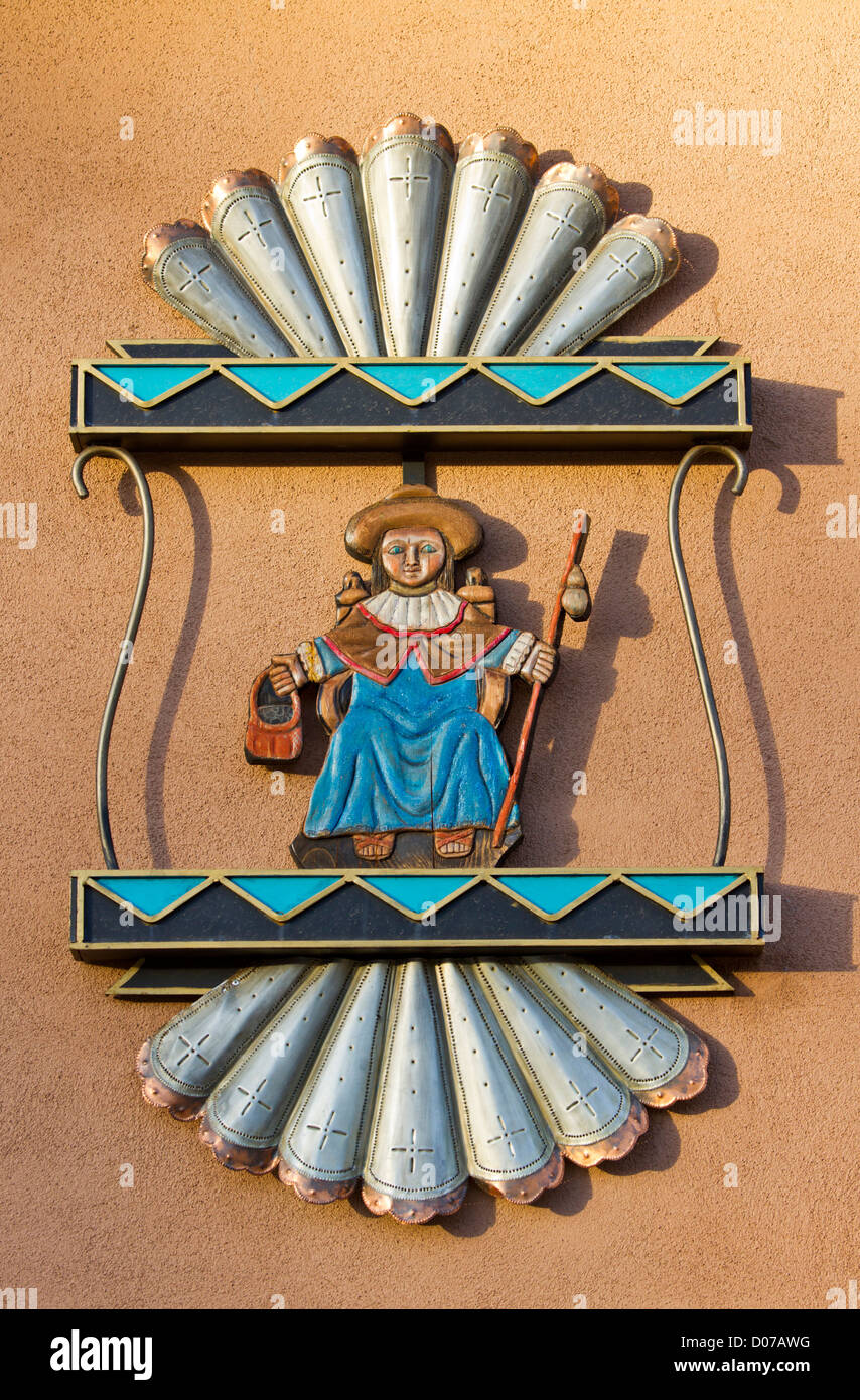 USA, New Mexico, Chimayo, Santo Nino de Atocha, a Roman Catholic image of the Child Jesus, outside of a church. Stock Photo