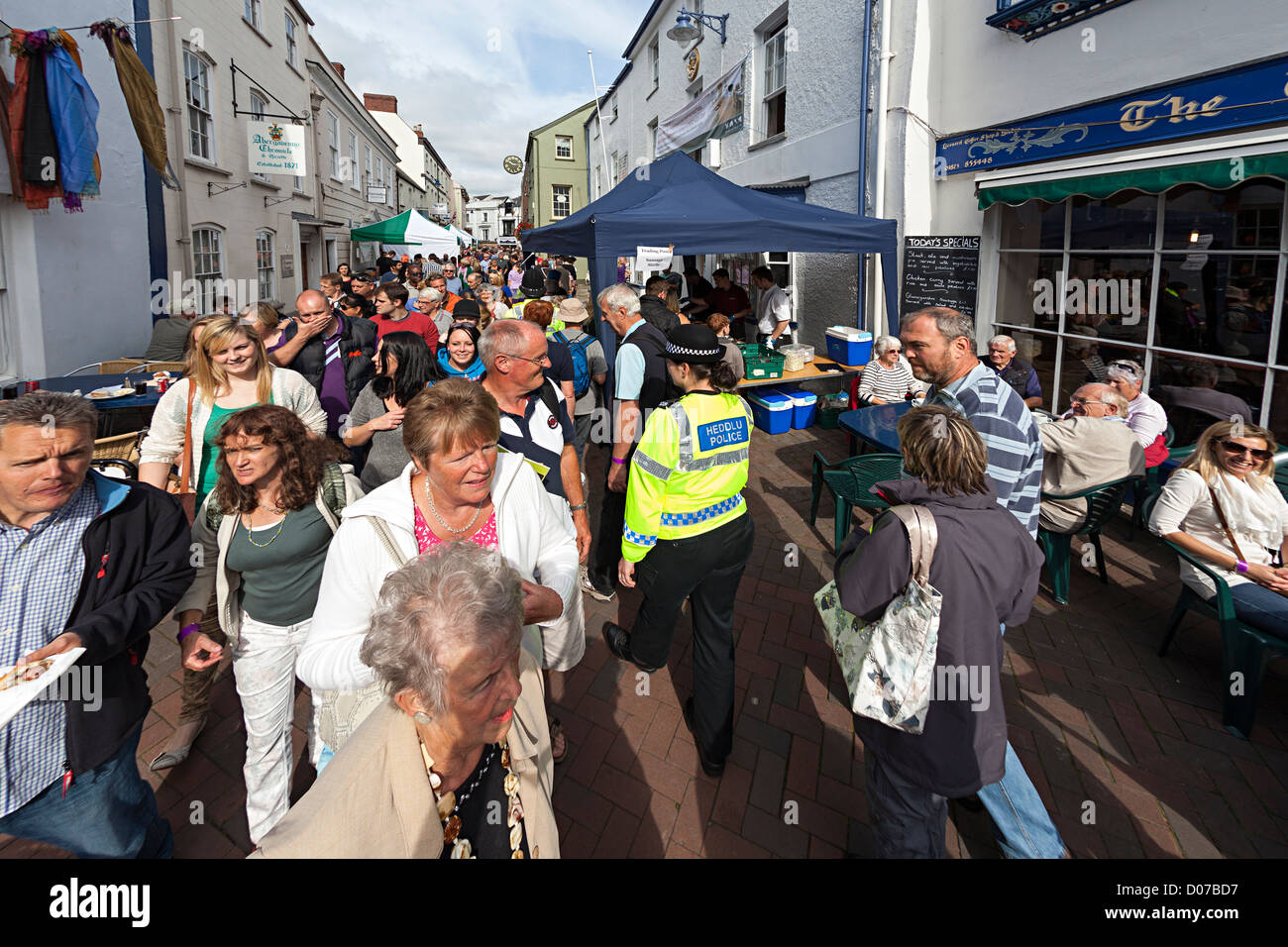 Crowds with police officer at Abergavenny Food Festival, Wales, UK Stock Photo