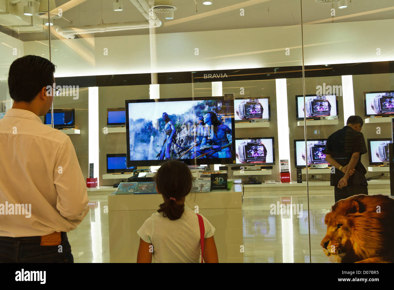 Little Girl Watching The Avatar Movie In A Display Window In A Shopping Mall In Bangkok Thailand Stock Photo Alamy