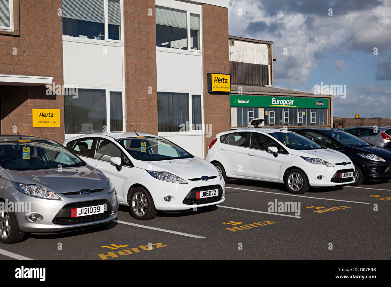 Hire car reception area for Hertz, Europcar, National and Alamo collection,  Jersey airport, Channel Islands, UK Stock Photo - Alamy