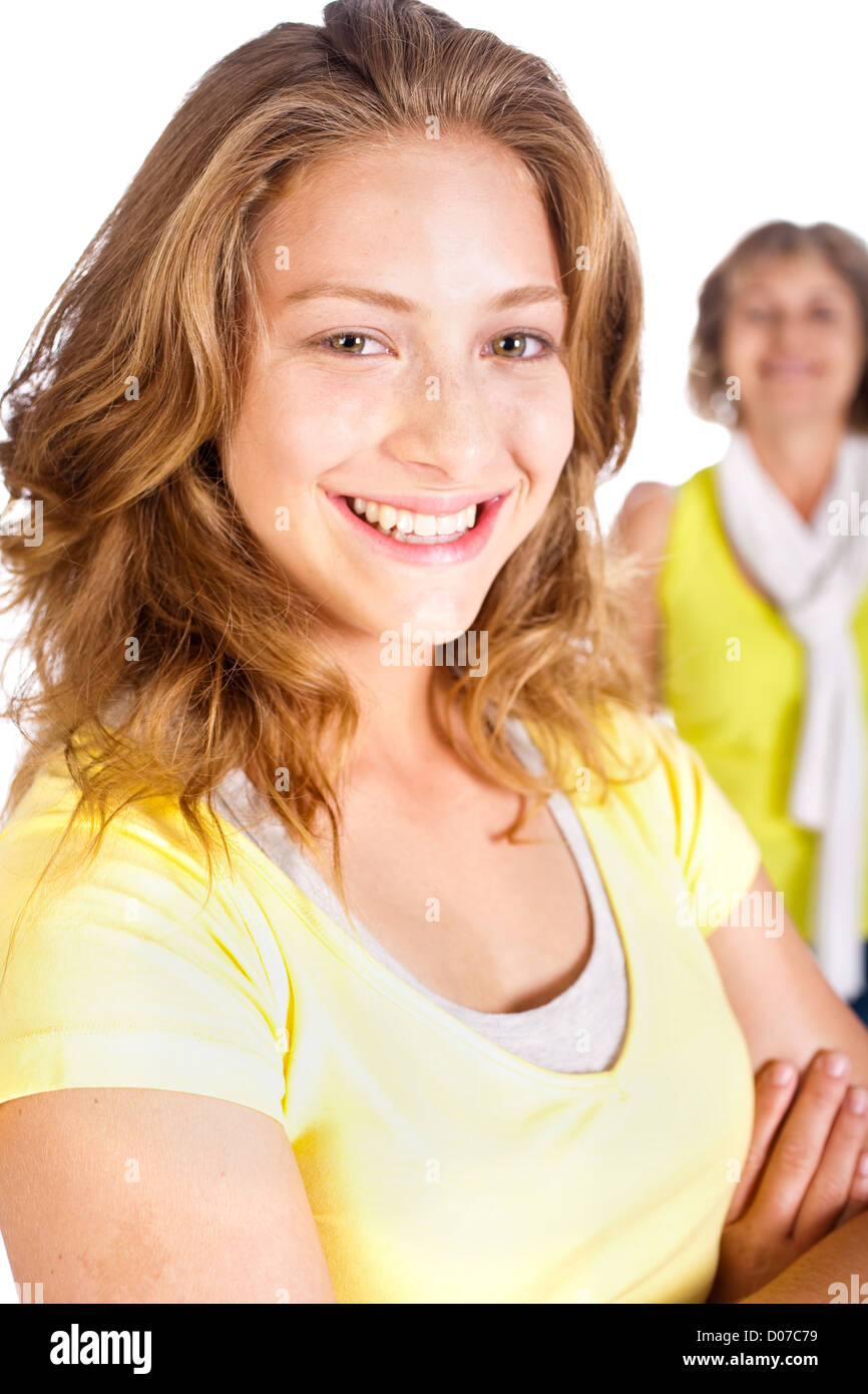 Gorgeous woman in focus with her mom in the background isolated on ...