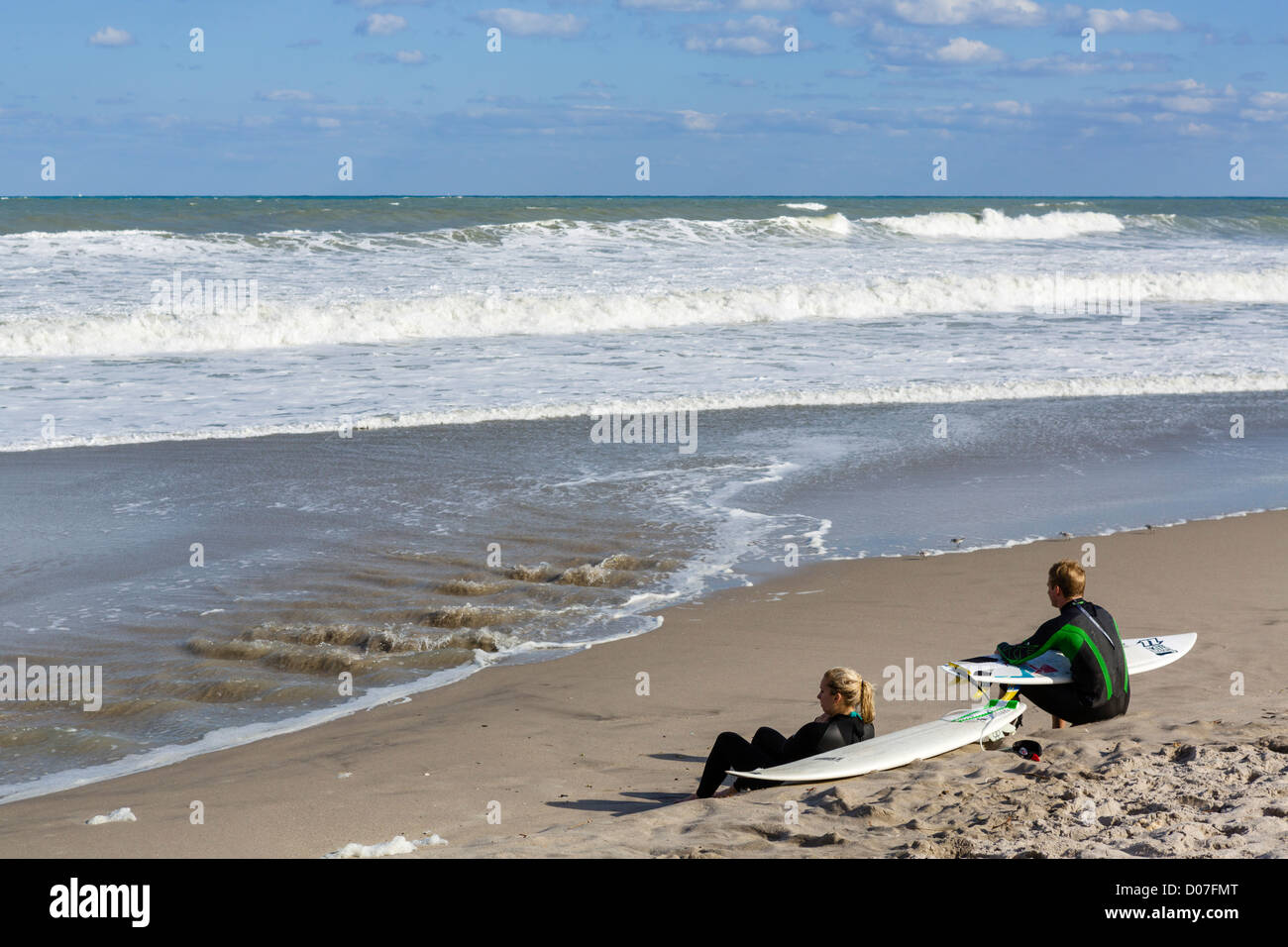 Young surfers resting on the beach in Jupiter, Treasure Coast, Florida, USA Stock Photo